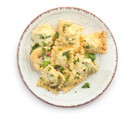 Fototapeta na wymiar Plate with tasty ravioli on white background