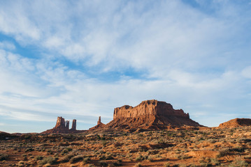 view of monument valley arizona with blue sky and clouds