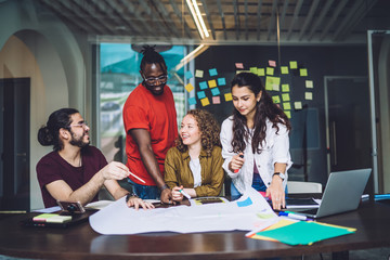 Young successful freelancers discussing business ideas