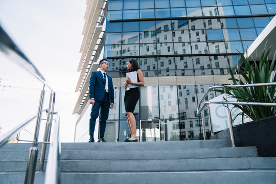 Hispanic female talking to partner in downtown
