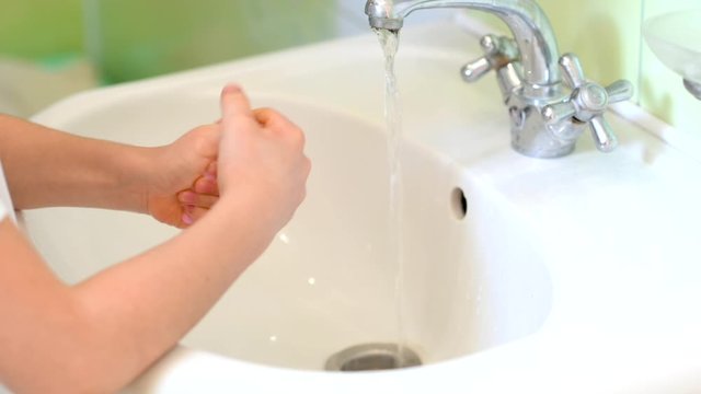 child washes his hands with soap with a bath. Clean hand concept. Healthcare