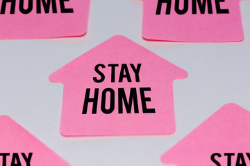 paper house with the phrase stay home - closeup