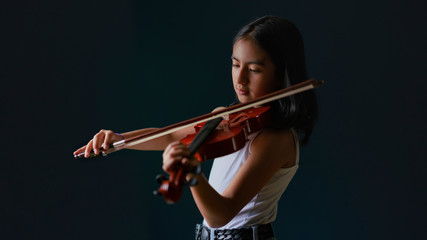 young woman playing violin time quaretiene  pandemic time