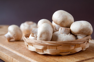 Still life: basket with mushrooms on a cutting Board