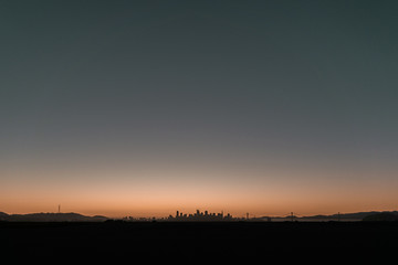San Francisco sunset from Alameda. City skyline, Sutro Tower and Bay Bridge views.