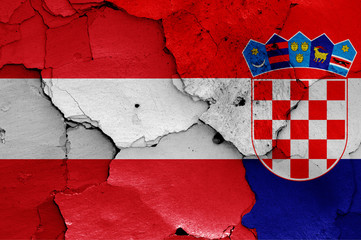 flags of Austria and Croatia painted on cracked wall