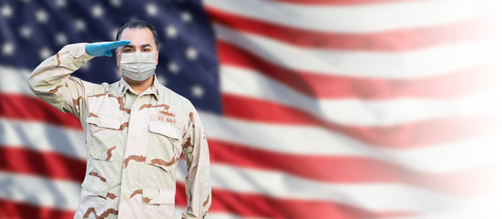 Male Navy Medical Personel Saluting Wearing Personnel Protective Exquipment (PPE) With American Flag Background Banner - obrazy, fototapety, plakaty