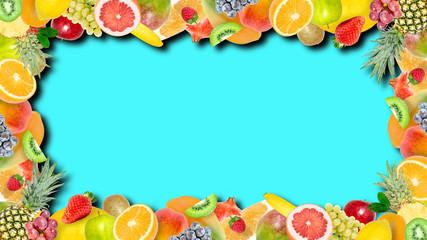 Creative photo of many different exotic tropical bright fruits frame with shadows on a summer blue background. View from above. Bright summer fruit pattern with copy space.