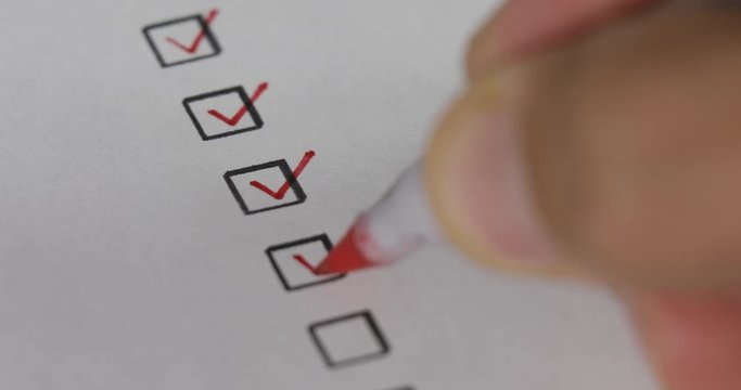 A person checking off a to do list with red pen. Check all the boxes of a checklist, close-up, 4k Person Ticks Checkbox Marks with a Pen, filling up To Do List.