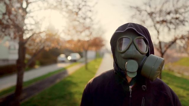 Adult affected by the COVID-19,wearing MC1airborne protection gas mask.Psychological stress of infectious disease panic and fear.Life in polluted contaminated area.Not enjoying spring nature.Allergy 