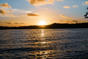 Beautiful sunset on water field