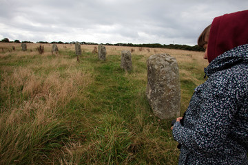 Lamorna (England), UK - August 16, 2015: A tourist looks The Merry Maidens stone circle, Cornwall, England, United Kingdom.