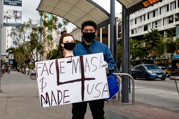 A man in the street sell face masks during coronavirus emergency in Los Angeles