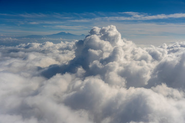 Flying above the clouds overlooking mount Kilimanjaro, Tanzania