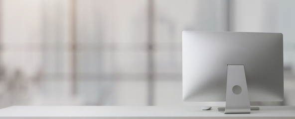 Close up view of simple workplace with  computer and copy space on white table