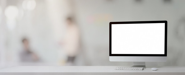 Close up view of simple workplace with blank screen computer and copy space on white table