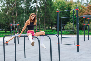 Fototapeta premium Woman relaxing after a evening workout outdoors