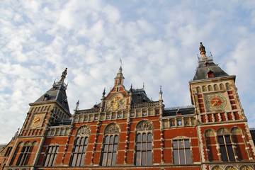 Front view of the Amsterdam Central (Centraal) Railway Station during sunset, Netherlands