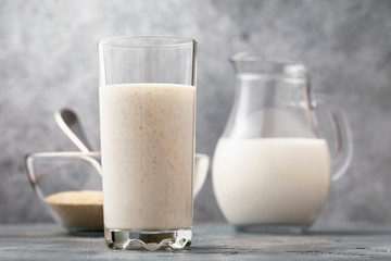A glass of kefir with bran on the table. Concept on the topic of a useful beverage for digestion