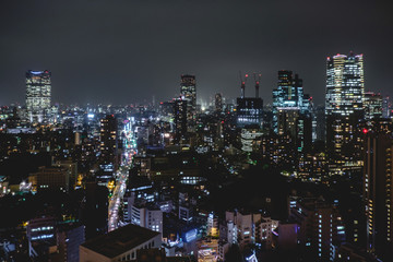Fototapeta na wymiar Panoramic view of Tokyo skyline, traffic and light by night from Tokyo Tower Observation Deck, Japan