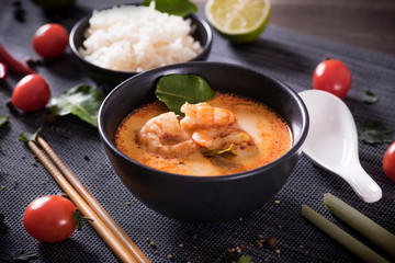 Tom Yum Goong Thai hot spicy soup with Ingredients on dark background