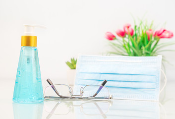 Medical face masks, Surgical mask and Alcohol gel bottle sanitizer hand for anti bacteria and virus protection on deck