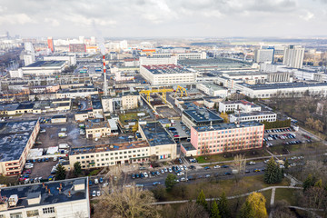 Obraz premium aerial top view of industrial buildings. manufacturing companies, factories and warehouses at urban industrial area