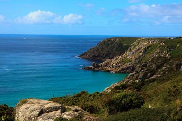 Fototapeta na wymiar Porthcurno (England), UK - August 16, 2015: Porthcurno coastline and cliffs, Cornwall, England, United Kingdom.
