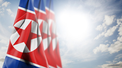 Close up waving flag of North Korea. National North Korea flag in the sky.