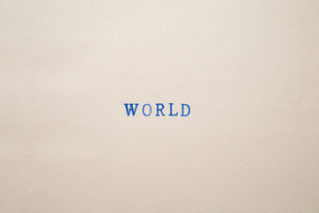 a WORLD word stamped on a piece of paper.