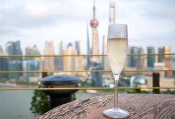 glass of champagne in the blurred background of Shanghai