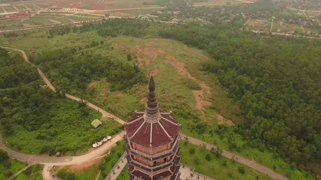 Aerial Circle Descending Shot of Xa Loi stupa at Bai Dinh Temple Spiritual and Culture Complex in Ninh Binh Vietnam, the largest spiritual tourist place in Vietnam