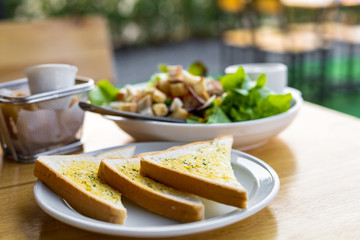 Tasty bread with garlic  on kitchen table.