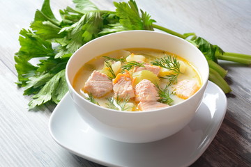 Creamy fish soup with salmon, potatoes, onions , carrots, dill and celery . Kalakeitto-traditional dish of the Finnish cuisine or Russian Ukha Fish Head Soup. Healthy Food Concept. Omega-3