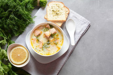 Creamy fish soup with salmon, potatoes, onions , carrots, dill and celery . Kalakeitto-traditional dish of the Finnish cuisine or Russian Ukha Fish Head Soup. Healthy Food Concept. Omega-3