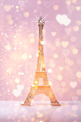 eiffel tower souvenir with pink bokeh shine  background and lights
