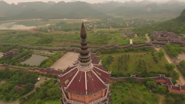 Aerial Circle Lookdown Shot of Xa Loi stupa at Bai Dinh Temple Spiritual and Culture Complex in Ninh Binh Vietnam, the largest spiritual tourist place in Vietnam