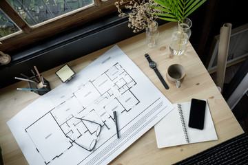 Top view workspace mockup of architectural project with architectural project plan, engineering...