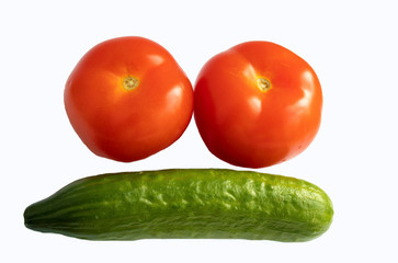 Fresh tomatoes and cucumber on a white background isolate