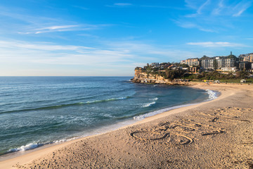 Stay Home sign drawn into the  sand at the closed Bronte Beach,Closed Tamarama Beach, Sydney...