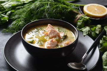 Creamy fish soup with salmon, potatoes, onions , carrots, dill and celery . Kalakeitto-traditional dish of the Finnish cuisine or Russian Ukha Fish Head Soup. Healthy Food Concept. Omega-3