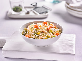 cous cous with vegetables on the background of the kitchen