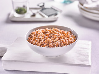 buckwheat with vegetables on the kitchen background