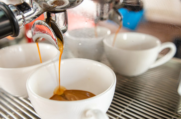 Obraz na płótnie Canvas Barista making a cup of coffee soft focus image 