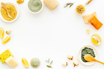 Mud mask - facial cosmetis flat lay - on white background top view copy space