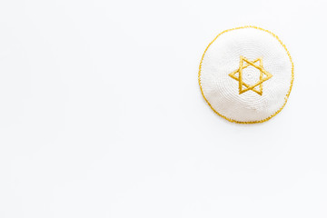 Jewish Kippah Yarmulkes hats with Star of David on white background. Religion Judaisim symbol. Top view, copy space