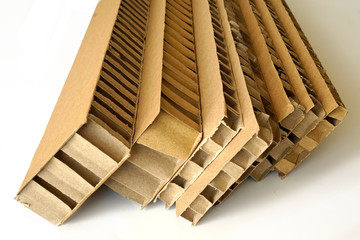 Sheets of brown corrugated cardboard used for filling in fragile parcels.