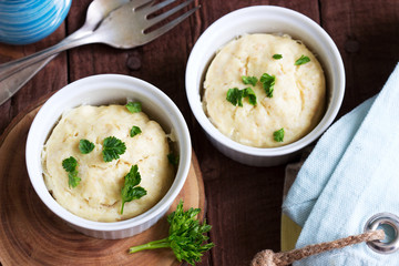 Dietary souffle of minced meat with parsley on a dark background.