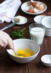 Ingredients and accessories for making omelet. Rustic style.
