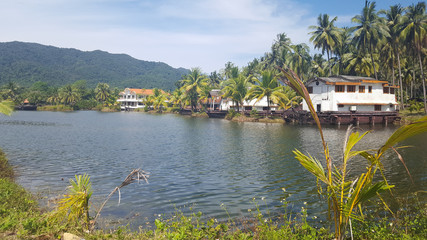 Fototapeta premium hotel bungalows in old ships in the jungle on the coast of Koh Chang